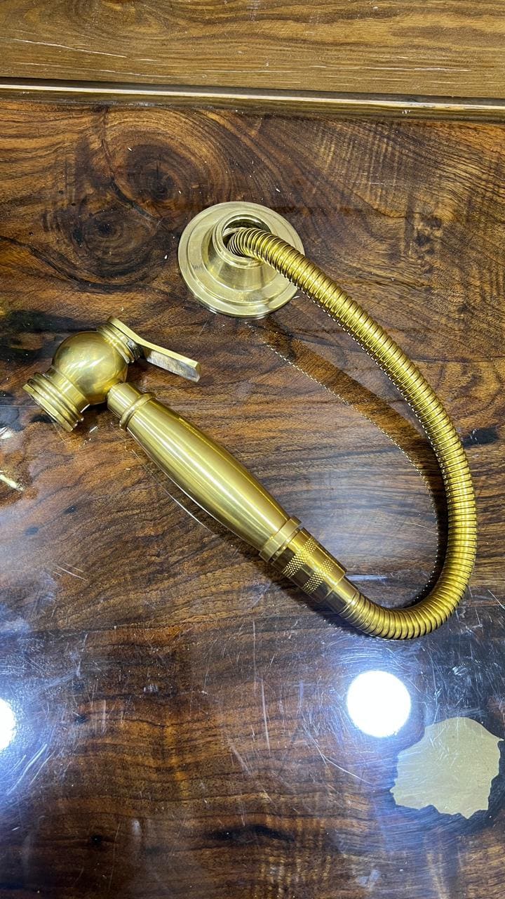 Unlacquered Solid Brass Sink side Sprayer faucet.