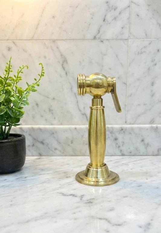Unlacquered Solid Brass Sink side Sprayer faucet.