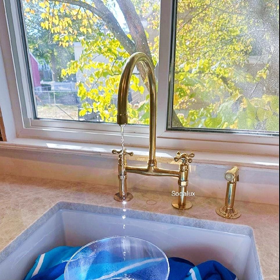 Unlacquered Brass Bridge Kitchen Sink Faucet with Sprayer.