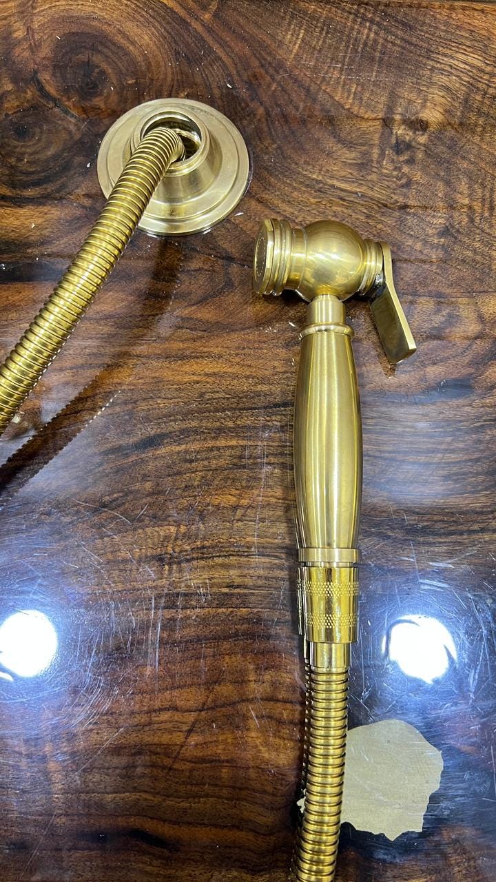 Unlacquered Solid Brass Sink side Sprayer faucet.