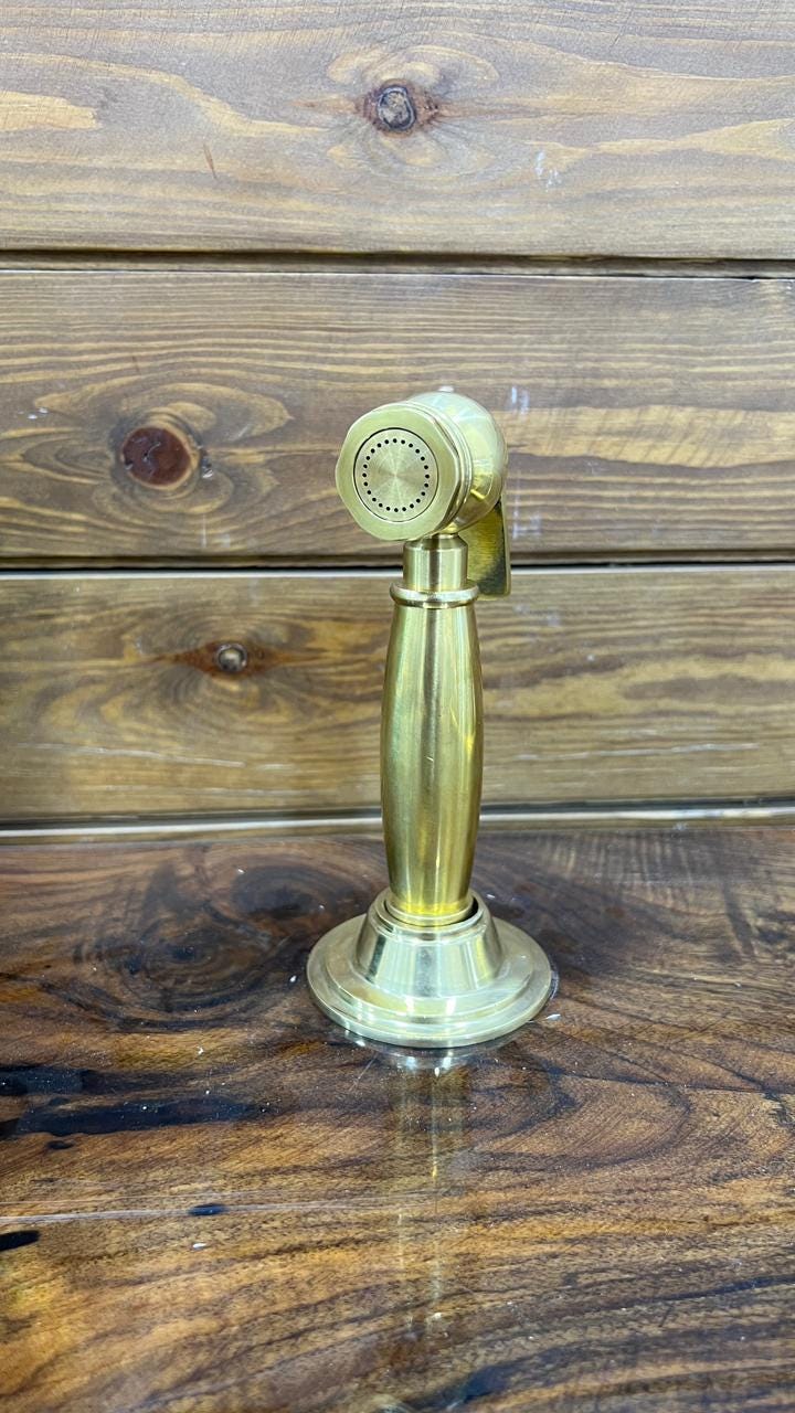 Unlacquered Solid Brass Sink side Sprayer faucet.