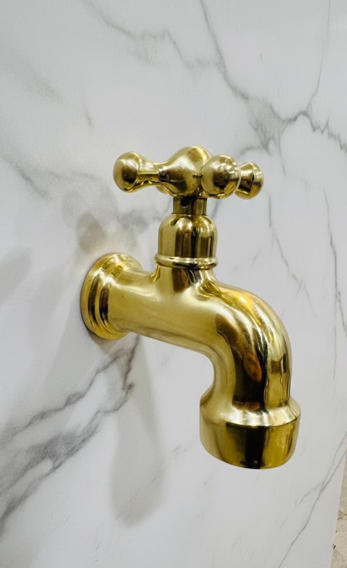 Unlacquered Solid Brass Classic Cross-Handle Wall Faucet.
