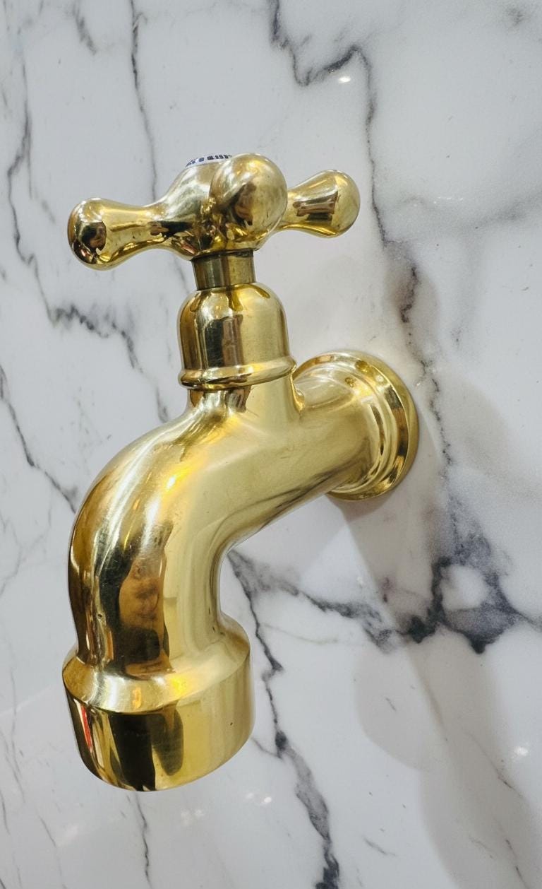 Unlacquered Solid Brass Classic Cross-Handle Wall Faucet.