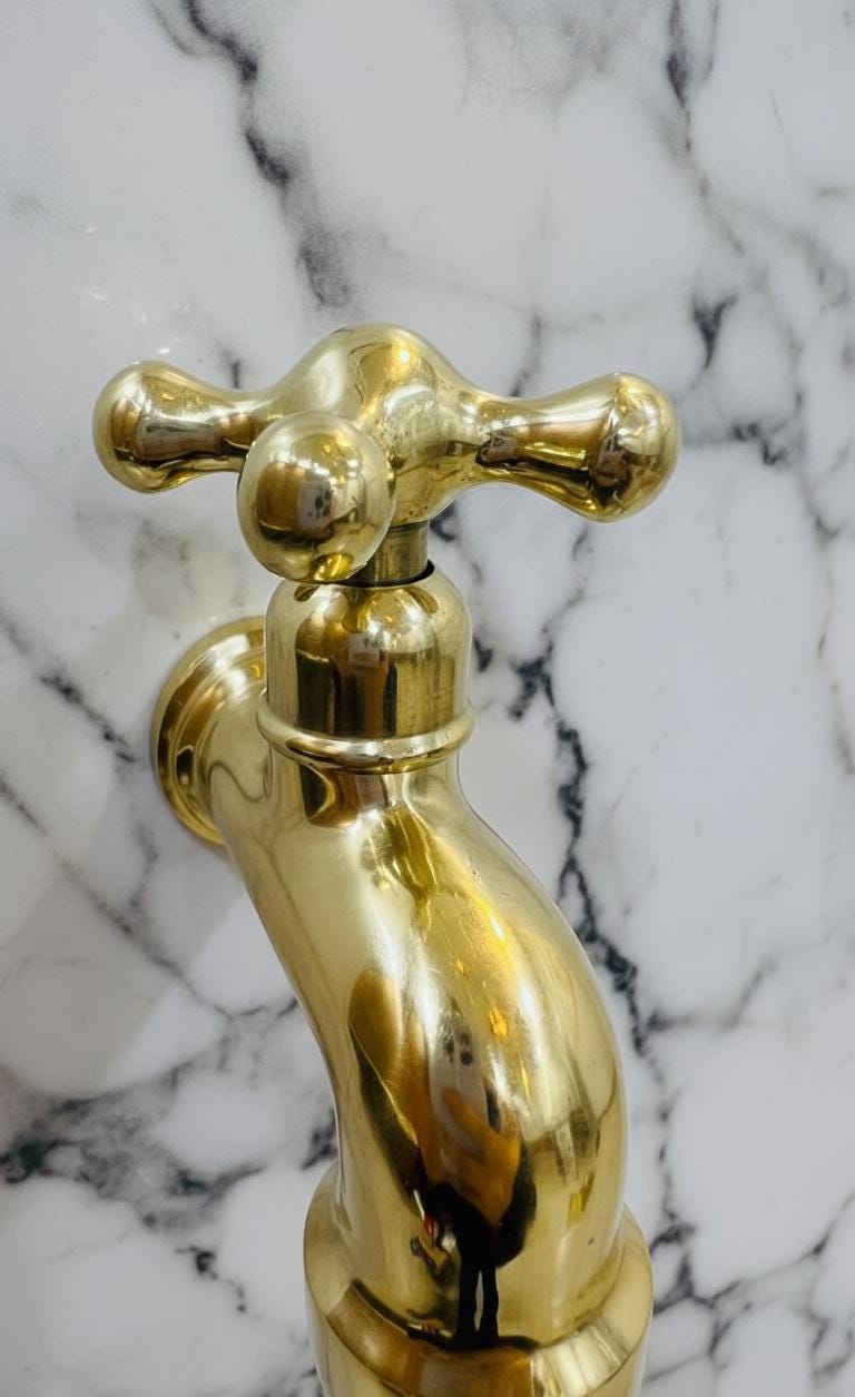 Unlacquered Solid Brass Classic Cross-Handle Wall Faucet.