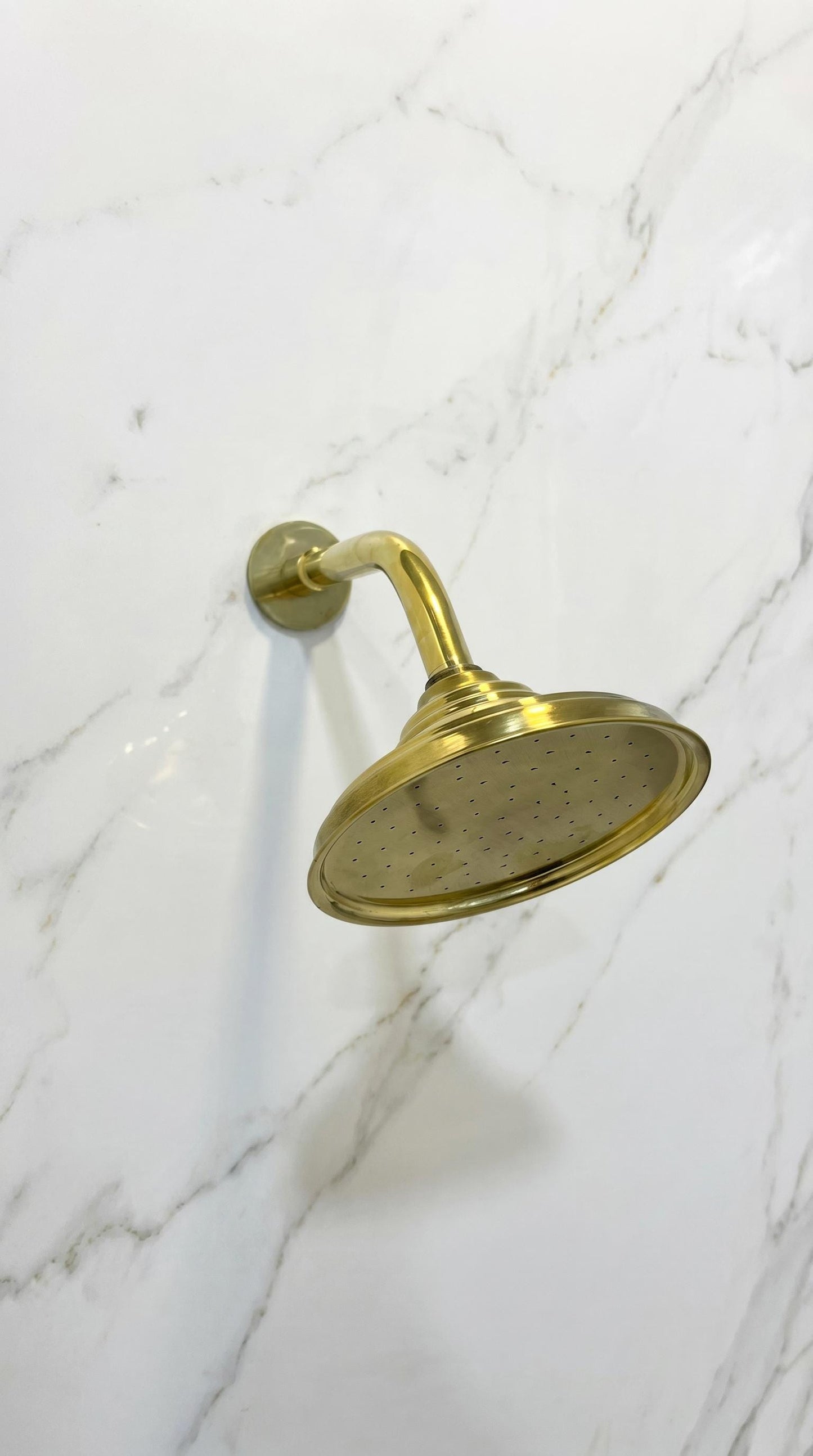 Unlacquered Brass Standard Shower Arm Extension With Shower Head.
